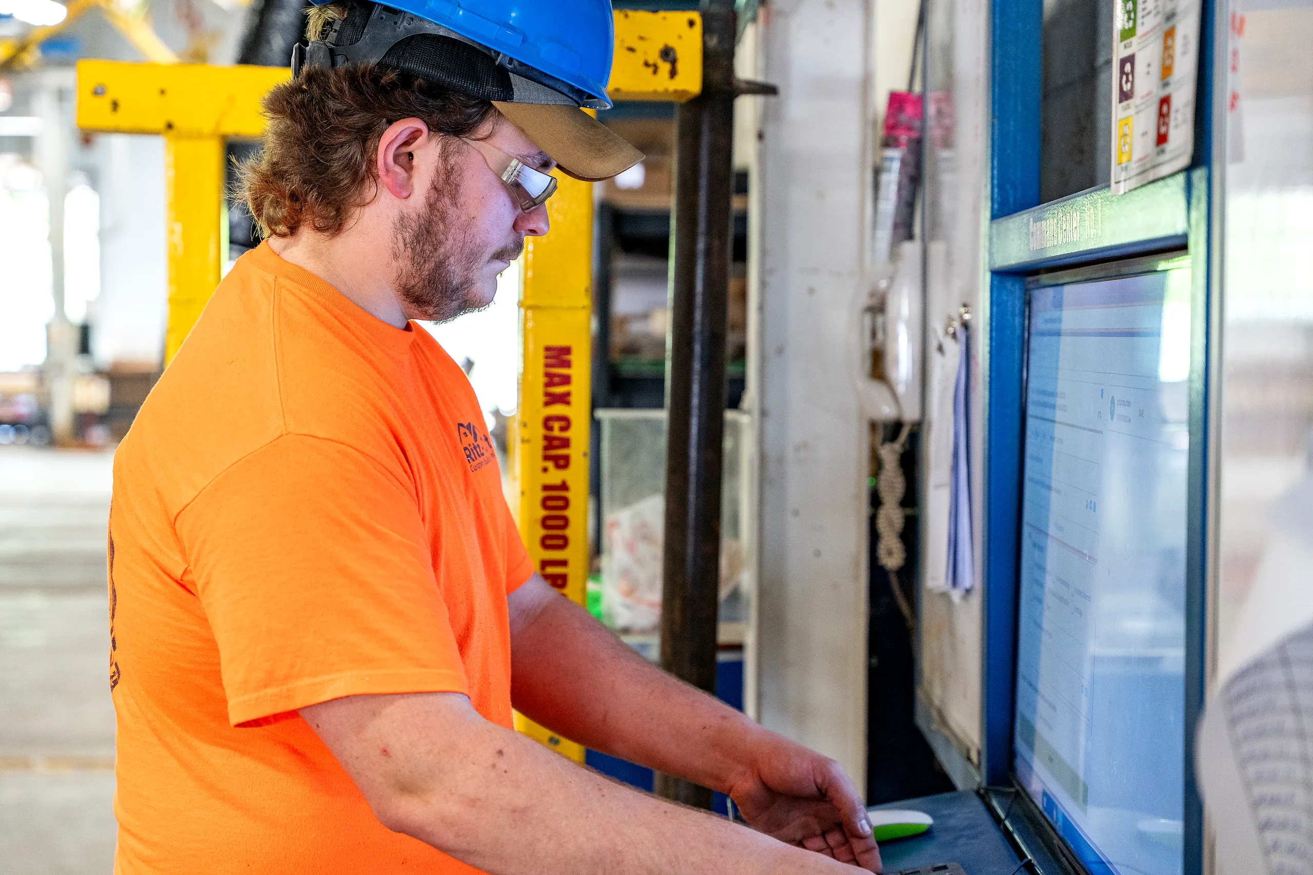 A plant manager reviewing the live floor board