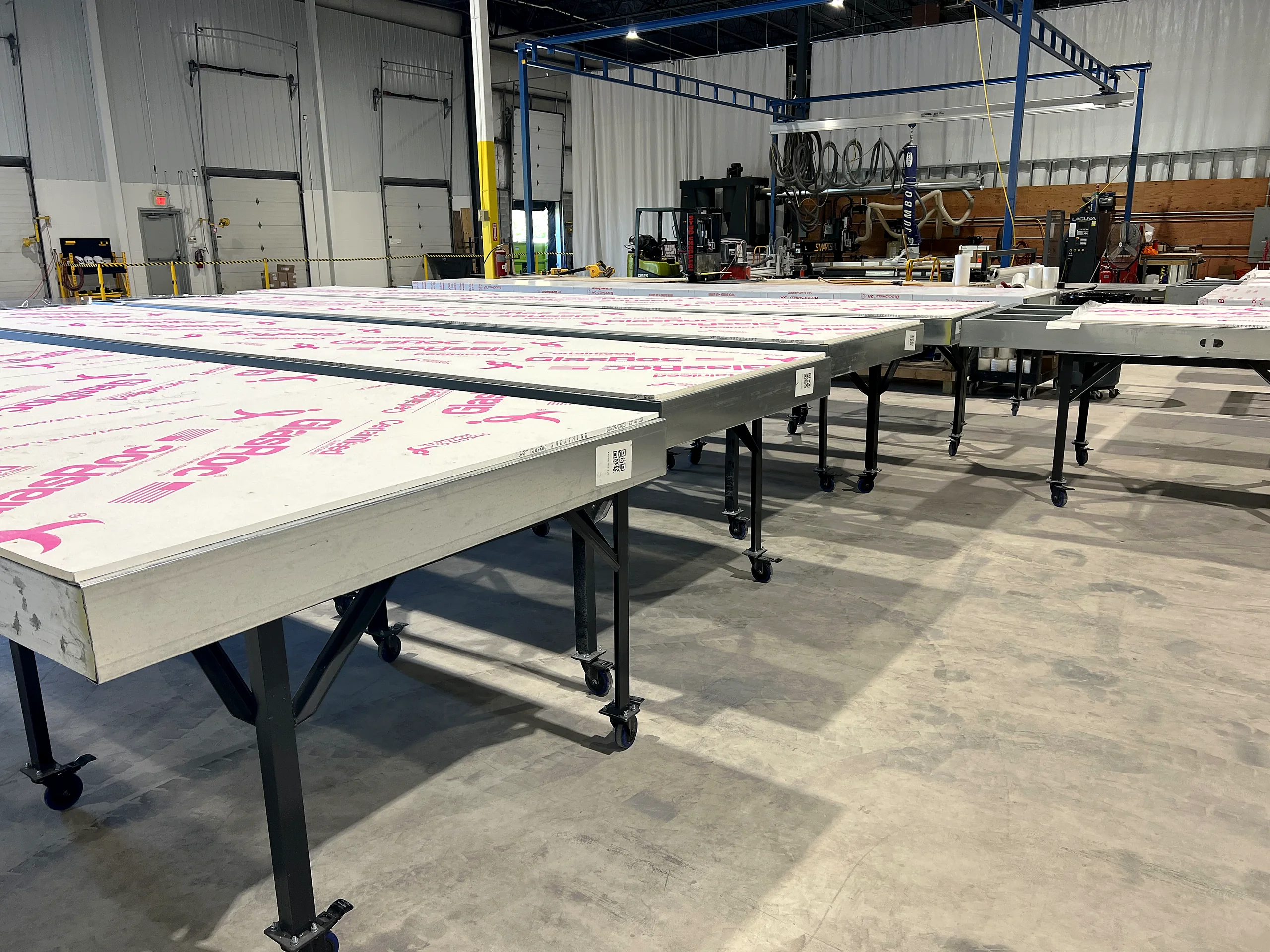 Drywall tables running on a prefabrication floor