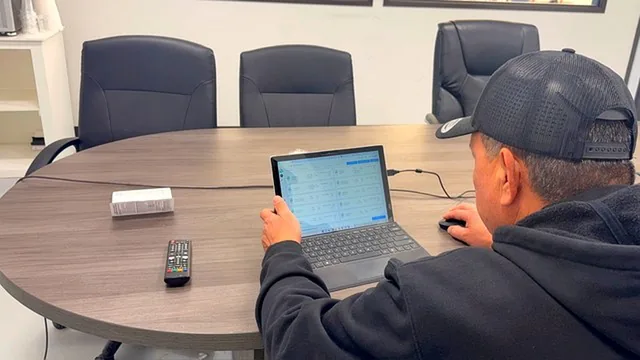 An S2A team member reviewing live factory information on a dashboard