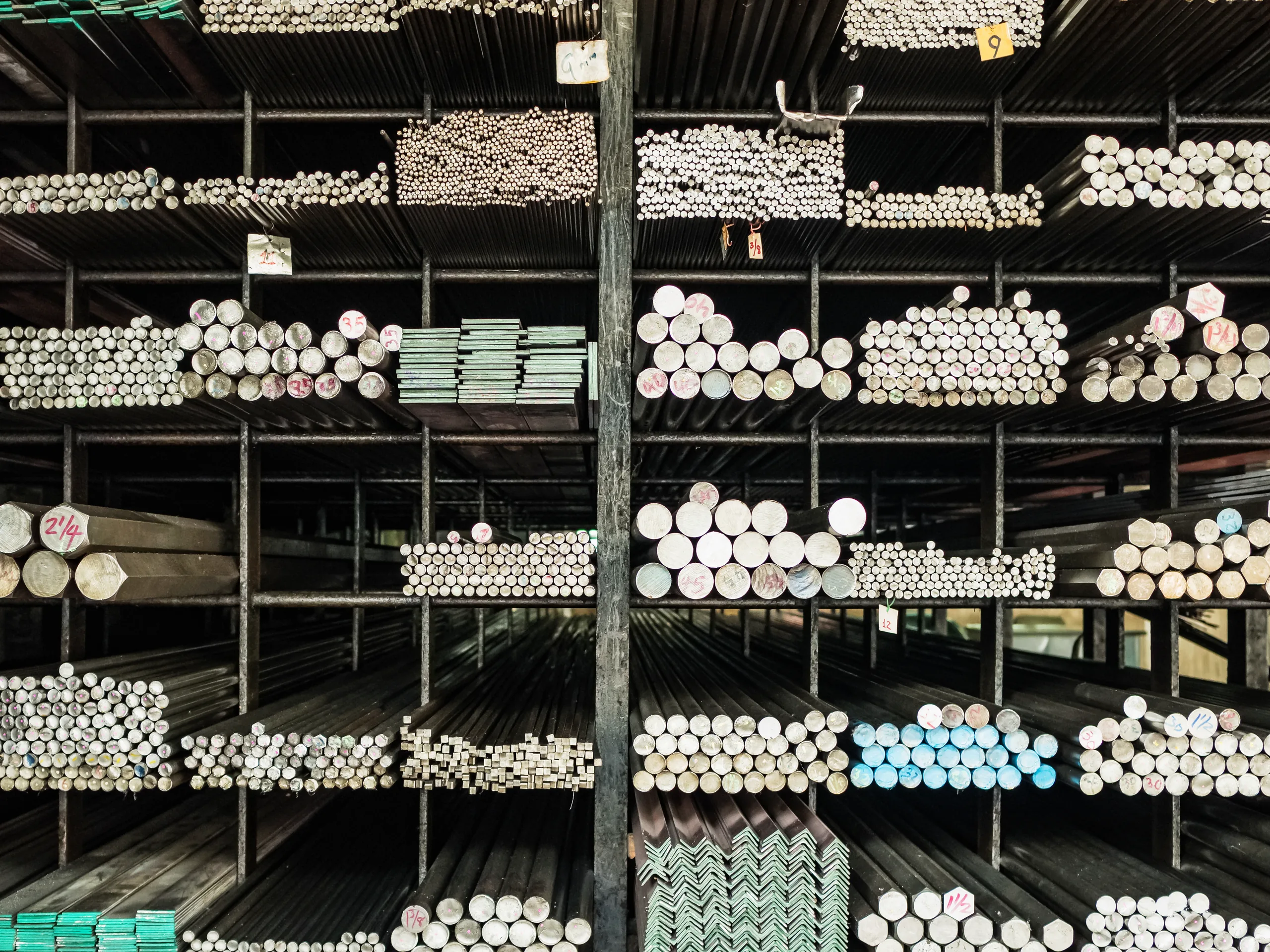 Bar stock and pipe organised in a material store